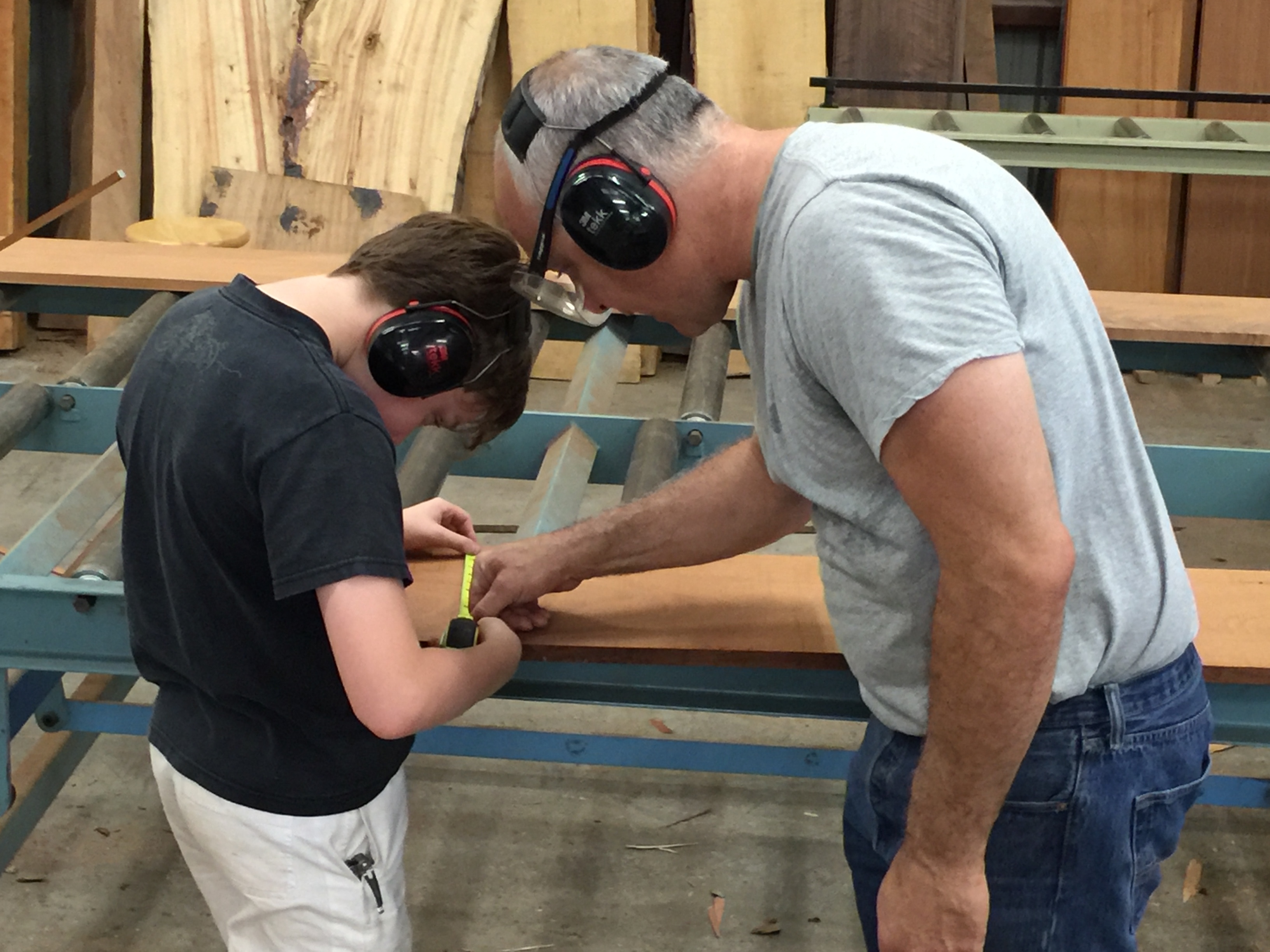James and his young son making a wide plank floor