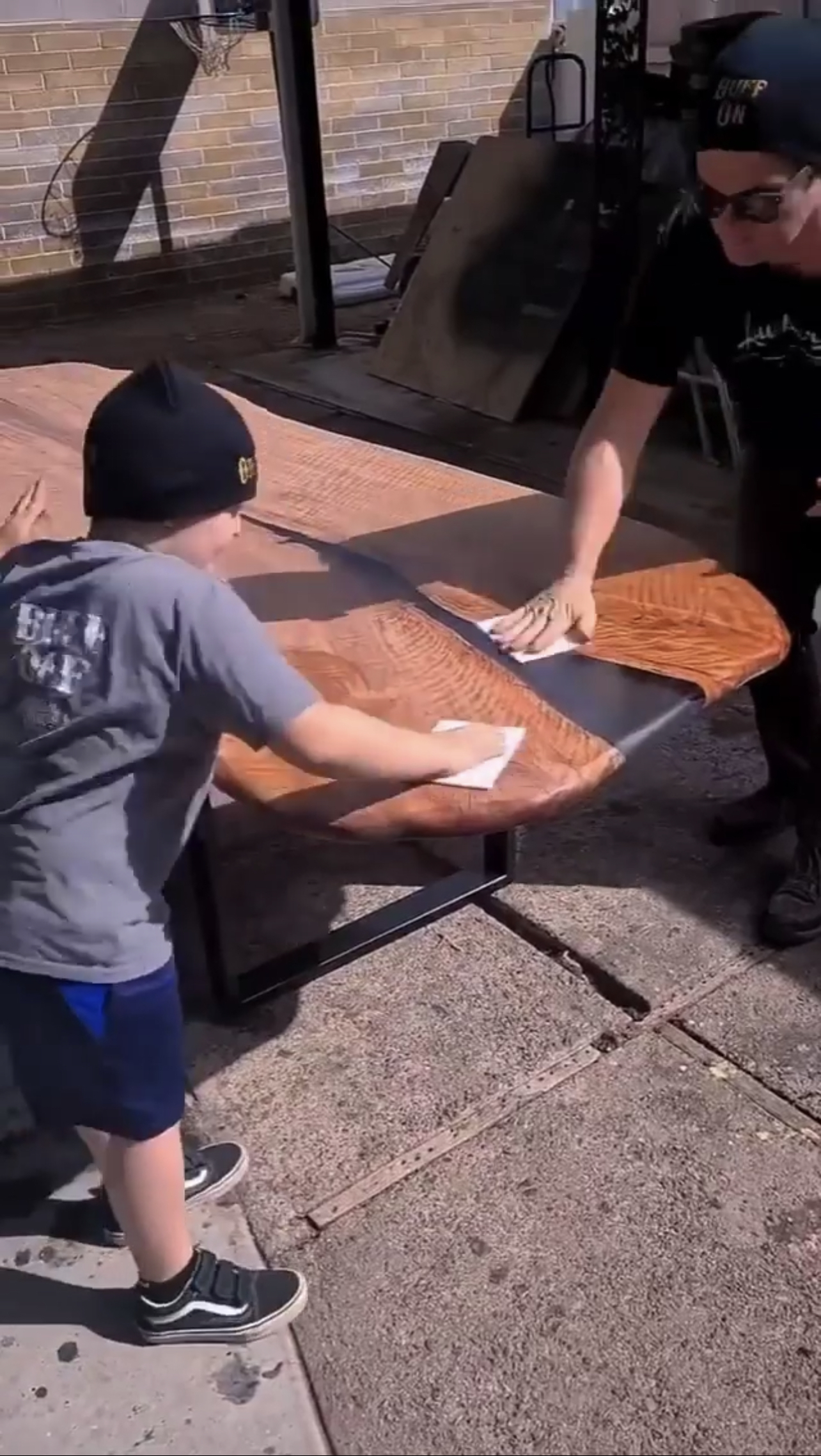 man-and-boy-finishing-table-with-odies